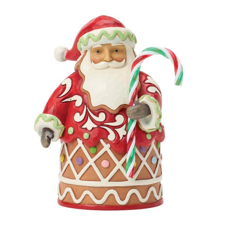 Een kerstmanfiguur met een zuurstok in zijn hand, gekleed in een rode jas versierd als peperkoek.