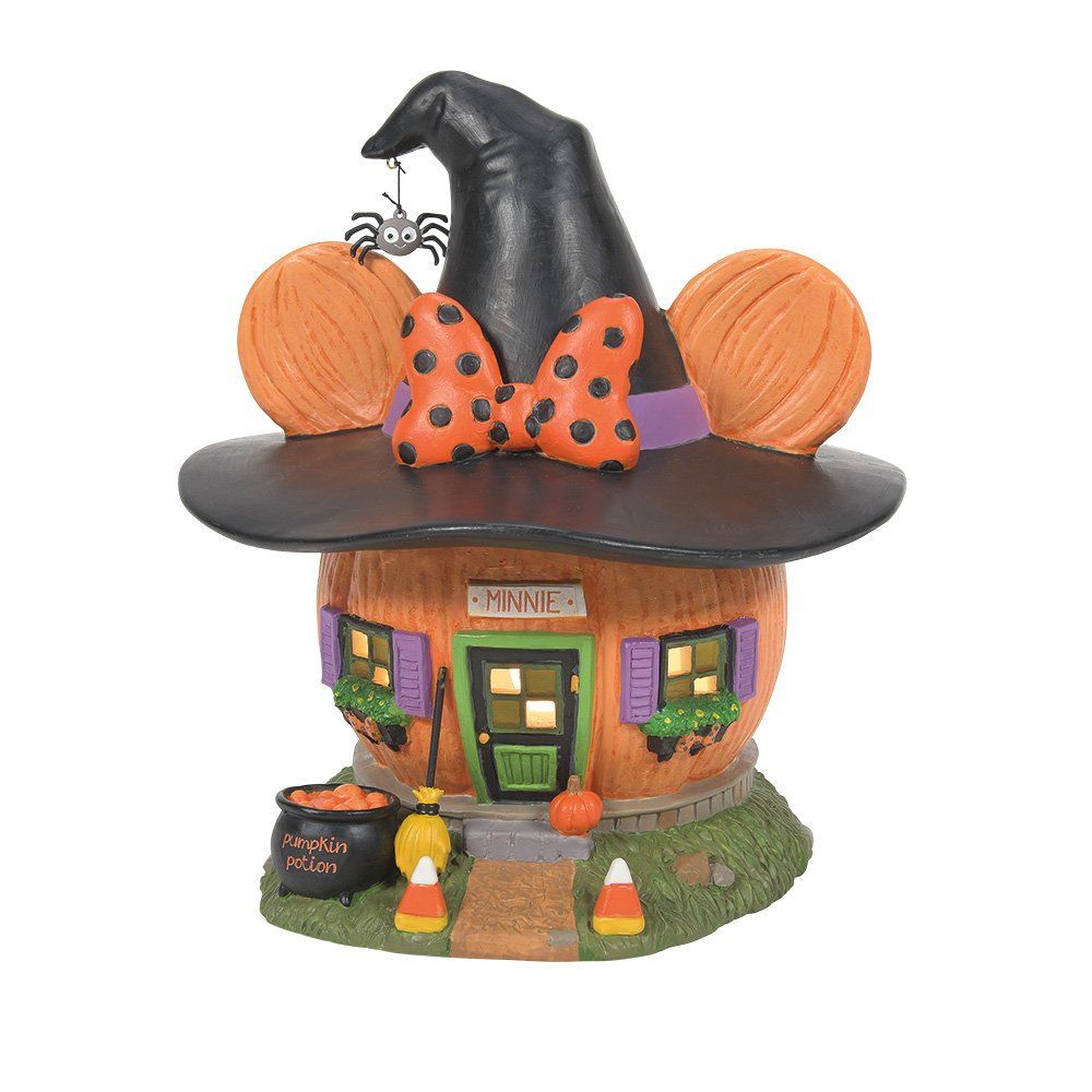 Halloweenversiering: een pompoenhuis met een heksenhoed, een Minnie Mouse-strik, een spin en snoepmaïs.
