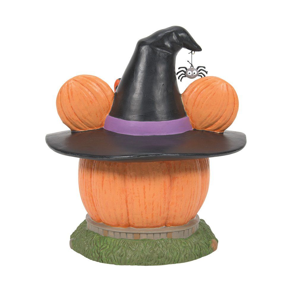 Halloweenversiering: een pompoenhuis met een heksenhoed, een Minnie Mouse-strik, een spin en snoepmaïs.