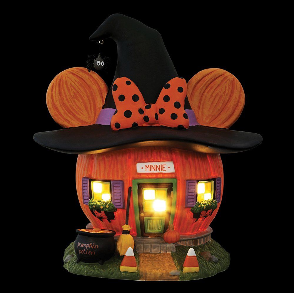 Halloween-thema Mickey Mouse pompoenhuis met zwarte heksenhoed, oranje strik, pompoenen, lampjes en heksenketel.