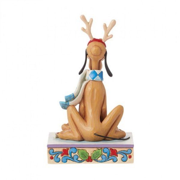 Pluto met gewei, sjaal en hoed, zittend op een versierde sokkel.