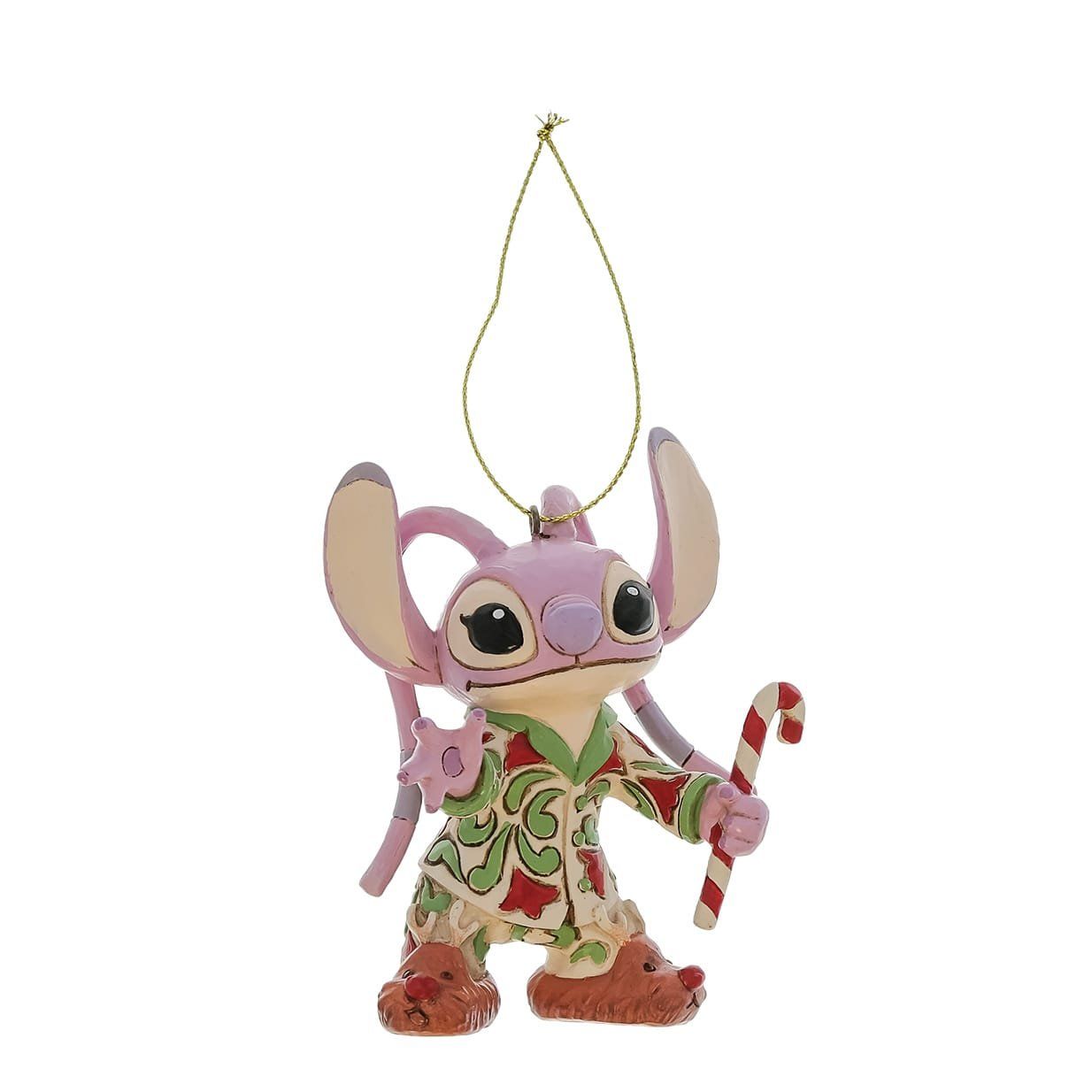 Een engeltje in pyjama met een zuurstok in zijn hand.