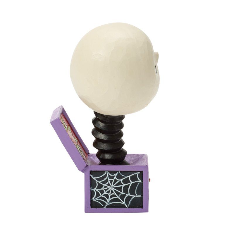 Een Halloween-verrassingsdoos met een witte schedel die eruit springt, een zwarte, opgerolde nek en een paarse doos met een spinnenweb.