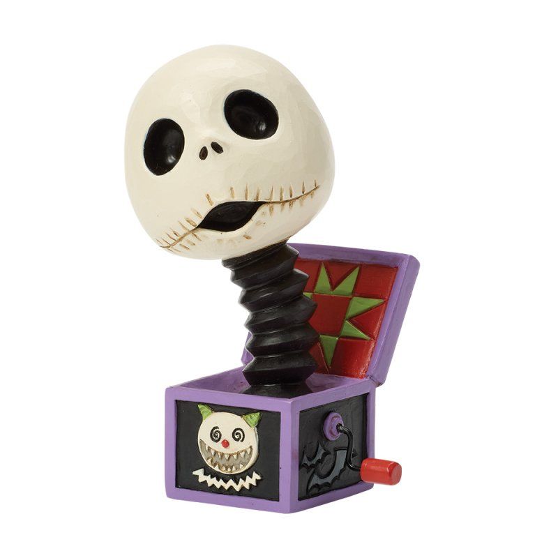 Jack Skellington bobblehead springpopje, zwarte en paarse doos, groene ster, griezelige uitdrukking.