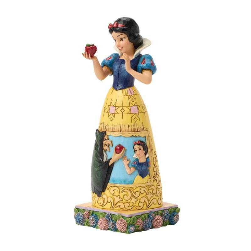 Een beeldje van Sneeuwwitje met een appel, waarop de Boze Koningin en een scène van de vergiftiging van de appel te zien zijn.