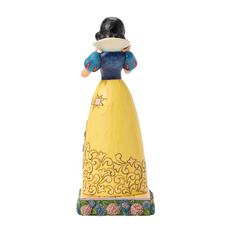 Sneeuwwitje-figuurtje, achterkant gezien, gele jurk, blauwe top en zwart haar.