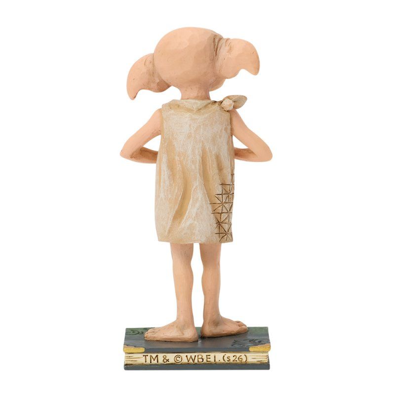 Dobby-figuurtje, achterkant. Beige huiself met een doek om, staand op een boekvormige sokkel.