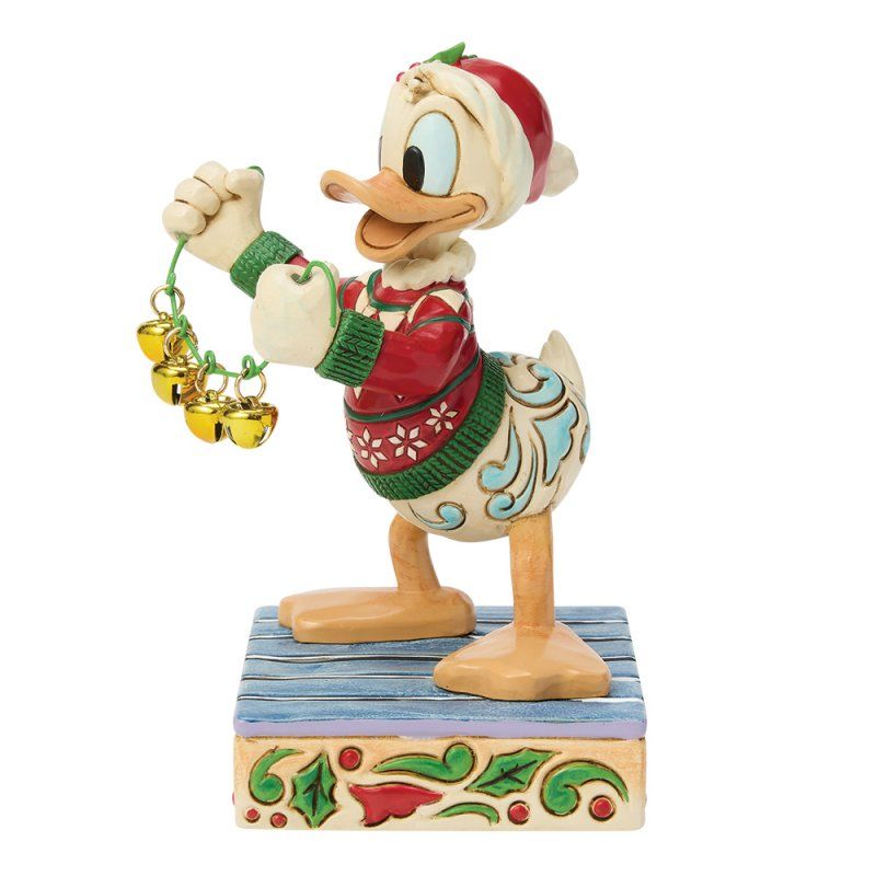 Een Donald Duck-figuurtje in een kersttrui, met kerstbelletjes in zijn hand.