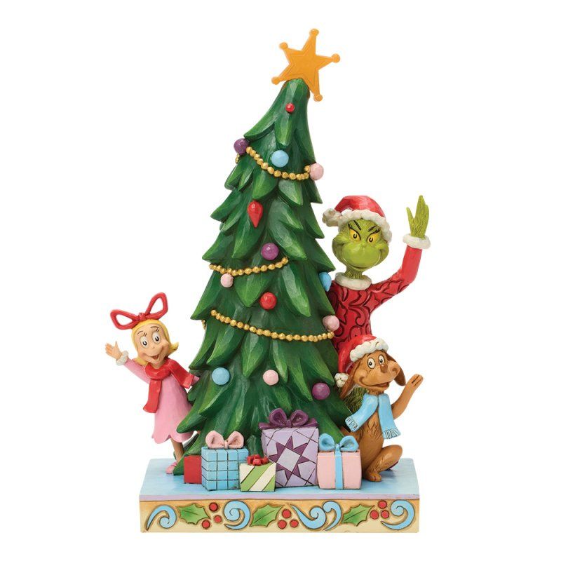De Grinch, Cindy Lou Who, Max en een kerstboomfiguurtje met cadeautjes, allemaal op een versierde sokkel.