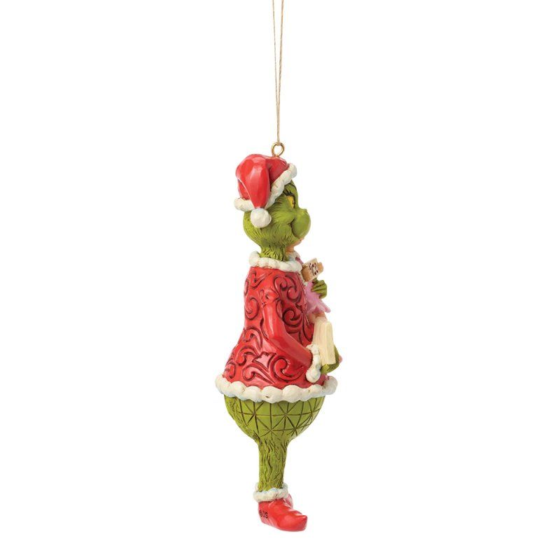 Een Grinch-ornament dat een meisje en een bordje met 'Stout' vasthoudt; het meisje houdt een bordje met 'Braad' vast.
