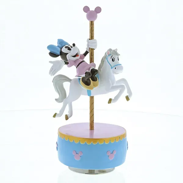 Minnie Mouse-figuurtje op een carrouselpaard. Blauwe voet met roze accenten.