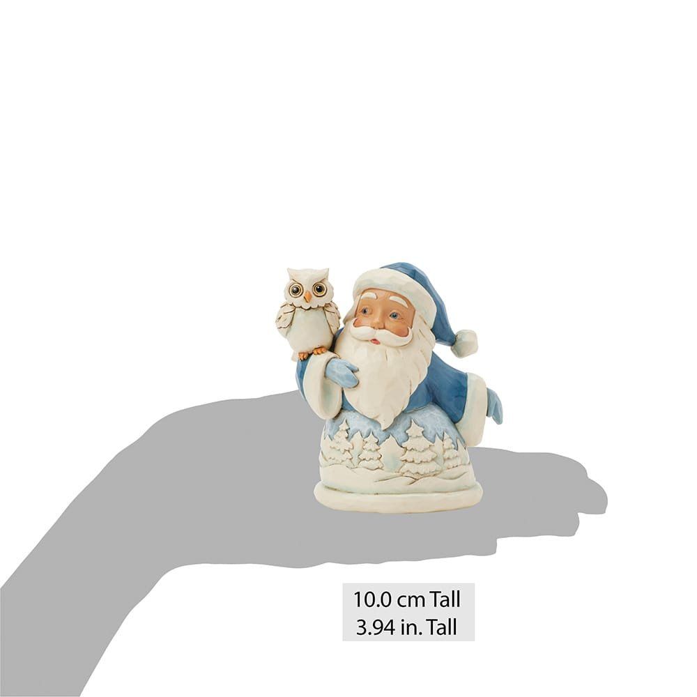 Een kerstmanfiguur in blauw met een uil.