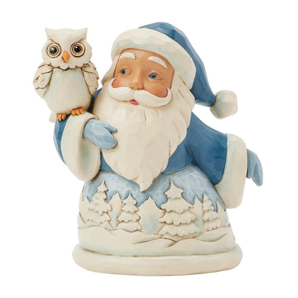 Een kerstmanfiguur in blauw met een uil.