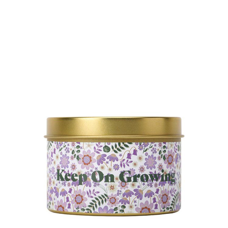 Geurkaars met Minnie Mouse-geur in een gouden blikje met bloemenpatroon, paars en wit design.