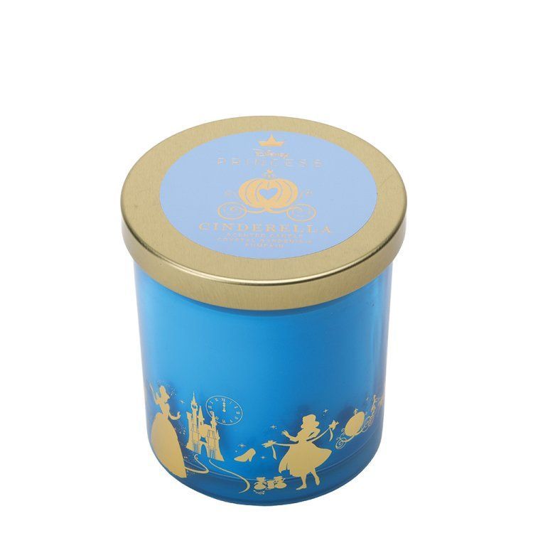 Blauwe kaars in een potje met gouden accenten en een silhouet van Assepoester.