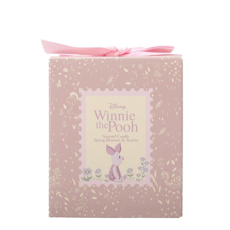 Roze Winnie de Pooh-cadeauverpakking met een roze lint. Met een illustratie van Knorretje.