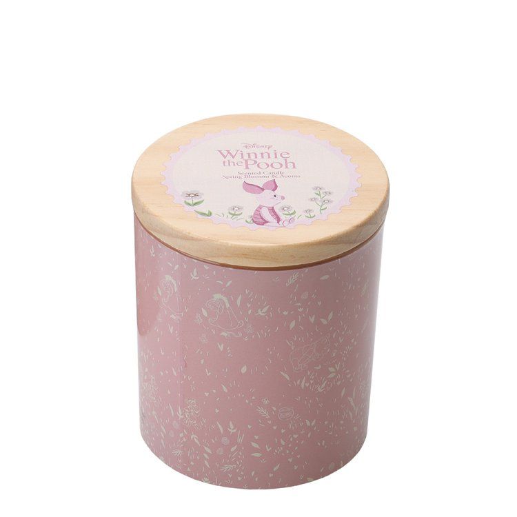 Roze gespikkelde kaarsenhouder met houten deksel.