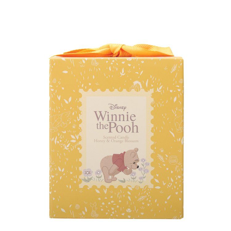 Gele Winnie de Pooh-cadeauverpakking met een strik erop. De verpakking toont Pooh in een bloemenveld.