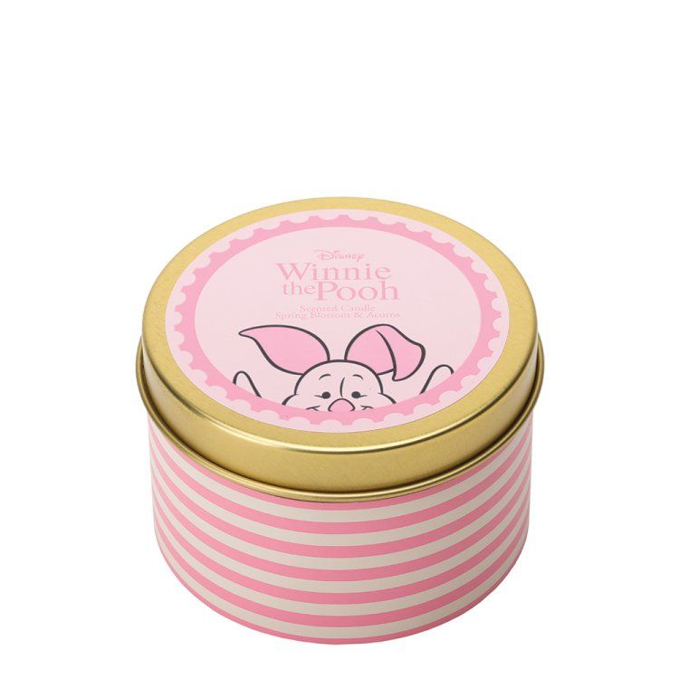 Roze blikken doos met Winnie de Pooh en Knorretje dat over de rand gluurt, tegen een witte achtergrond.