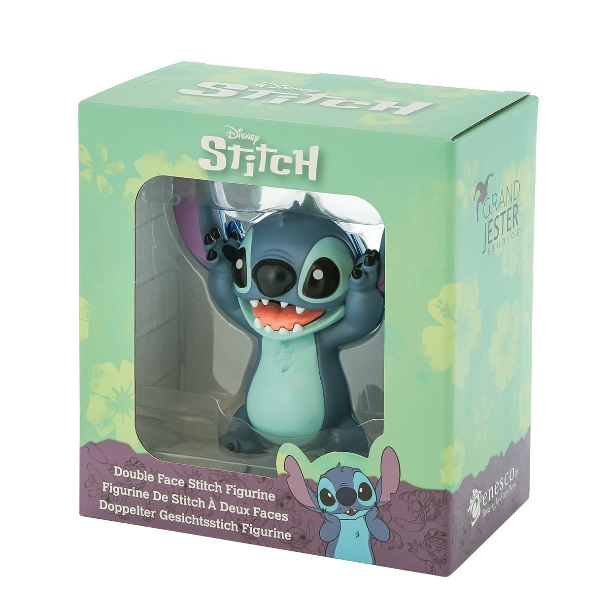 Stitch-figuurtje in doos. Blauw wezentje met grote oren en tanden, armen omhoog. De doos is groen met een venster.