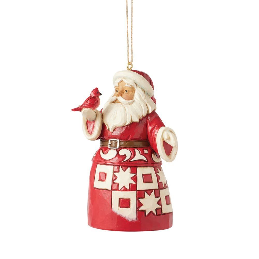 Kerstornament van de Kerstman met rode mantel, die een kardinaal vasthoudt.