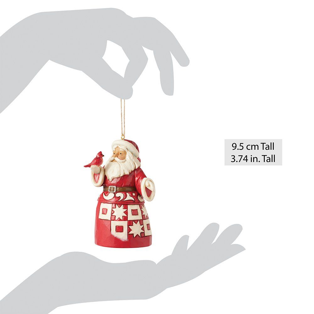 Kerstornament van de Kerstman met rode mantel, die een kardinaal vasthoudt.