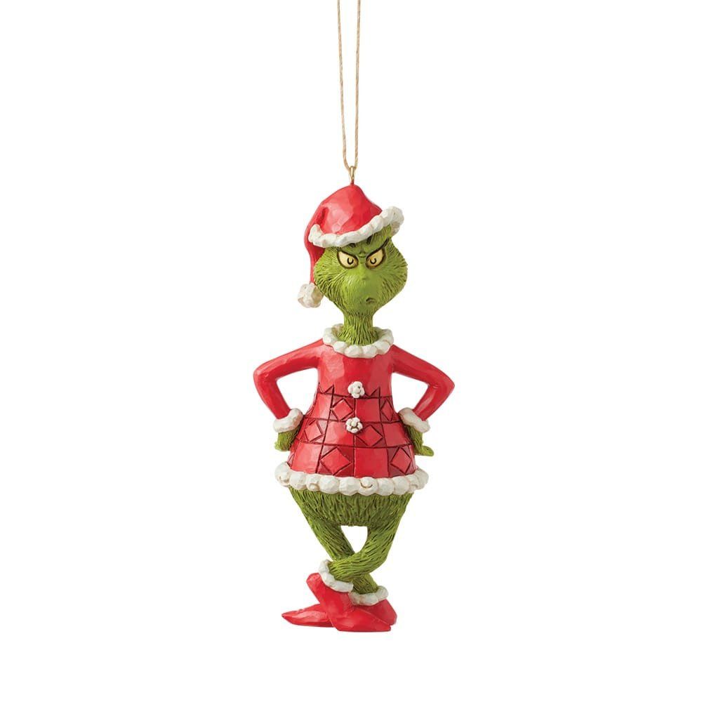 Kerstornament van de Grinch in een rood pak en kerstmuts, armen in de zij, groene huid.