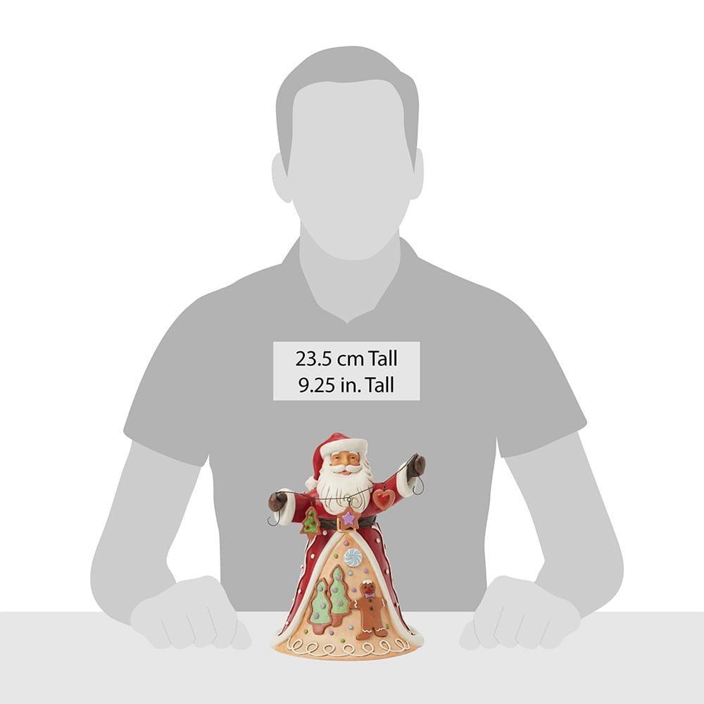 Een kerstmanfiguurtje met een slinger peperkoekversieringen. Rood en wit, met een lachend gezicht.