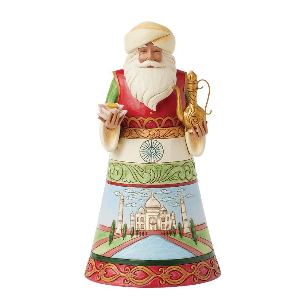 Figuur van de Kerstman gekleed in kleding met een Indiaans thema, met een lamp en een gouden kruik in zijn handen.