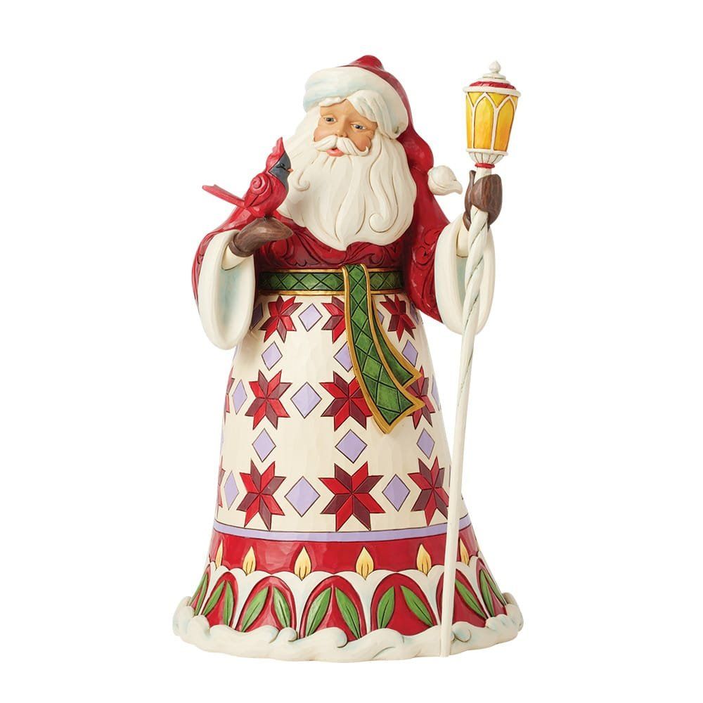 Feestelijk kerstmanfiguurtje, in rode jas, met een lantaarn en een kardinaal.