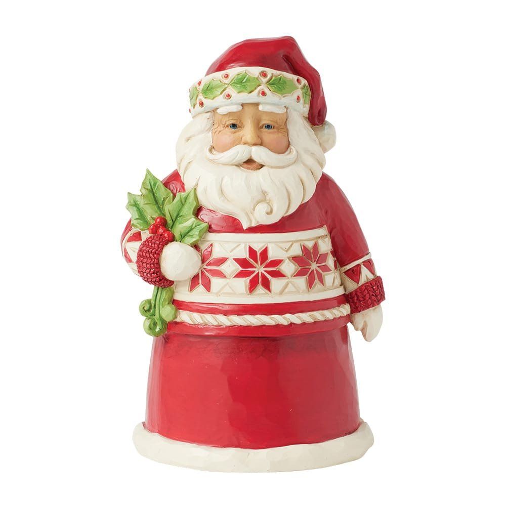 Een kerstmanfiguur in een rode trui met een takje hulst in zijn hand.
