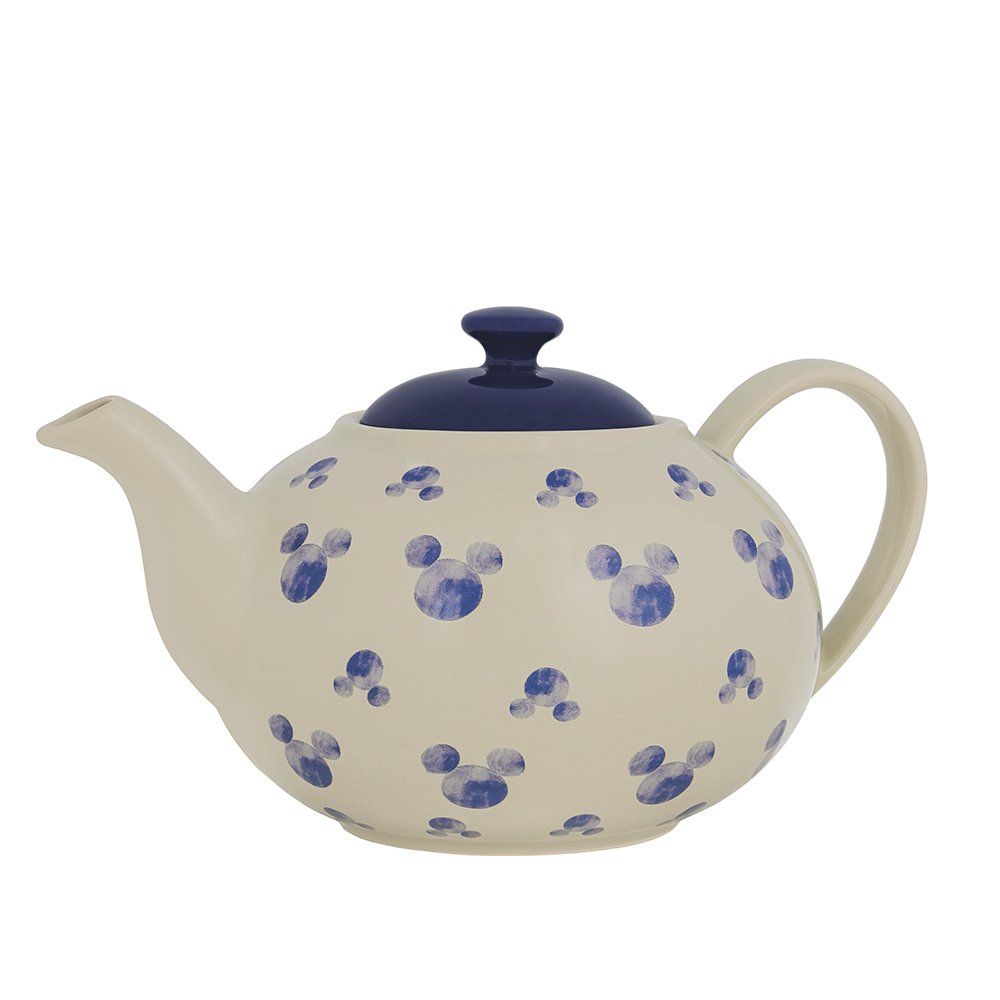 Witte theepot met blauwe Mickey Mouse-silhouetten en een donkerblauw deksel.