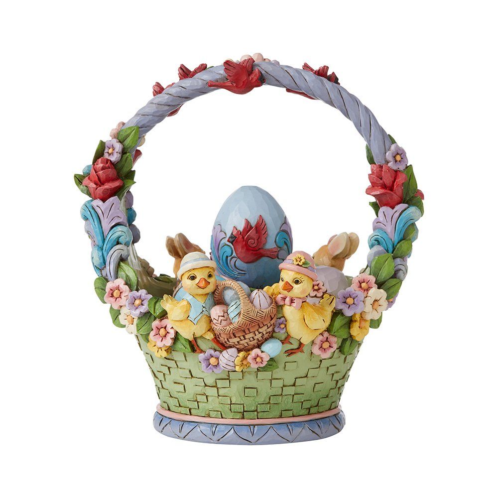 Paasmandje met konijntjes, ei, bloemen en een decoratief handvat.
