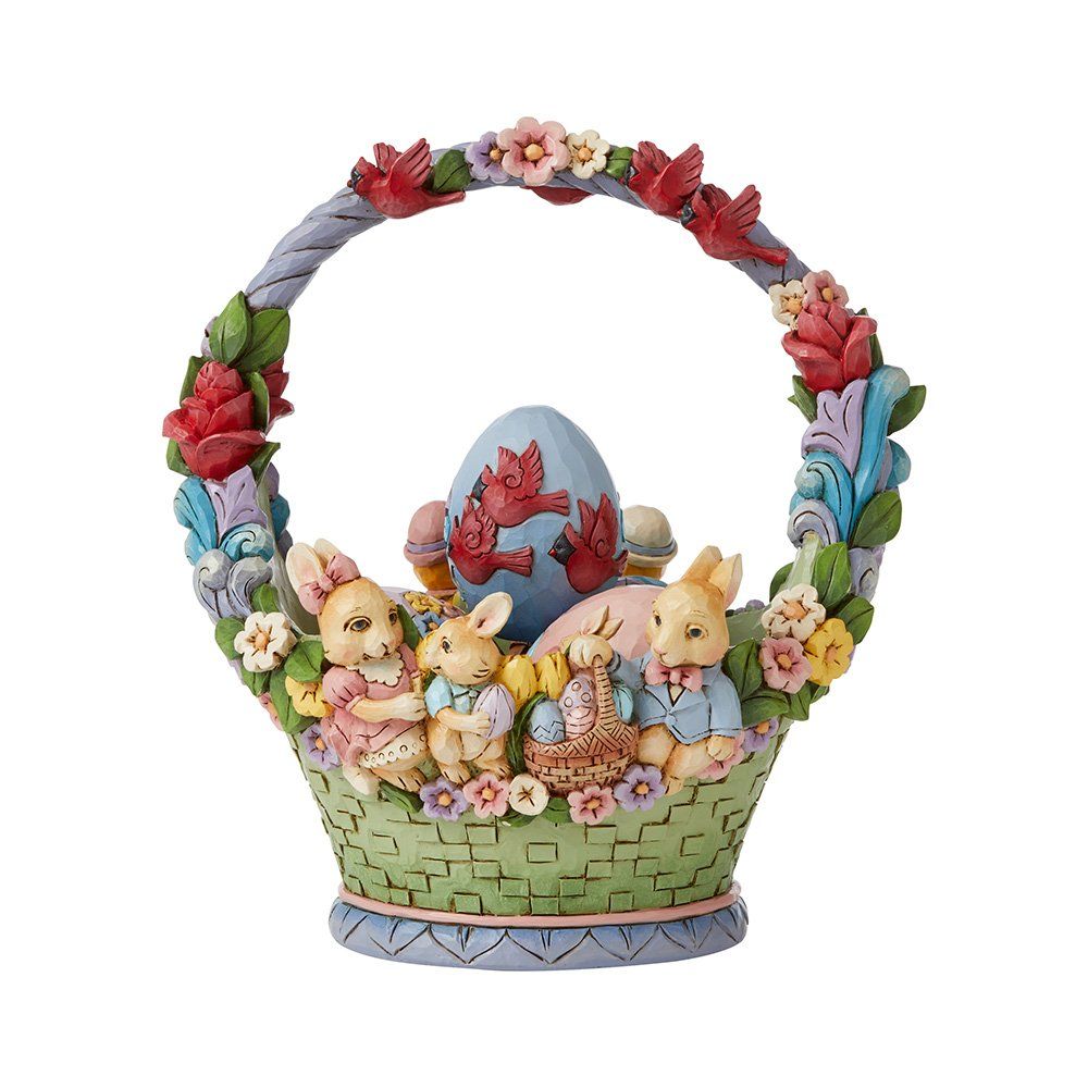 Paasmandje met konijntjes, ei, bloemen en een decoratief handvat.