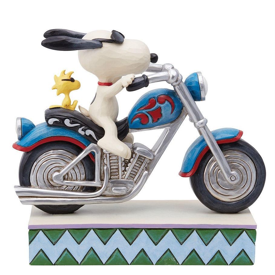Snoopy op een blauwe motor met Woodstock, rijdend op een ondergrond met een zigzagpatroon.