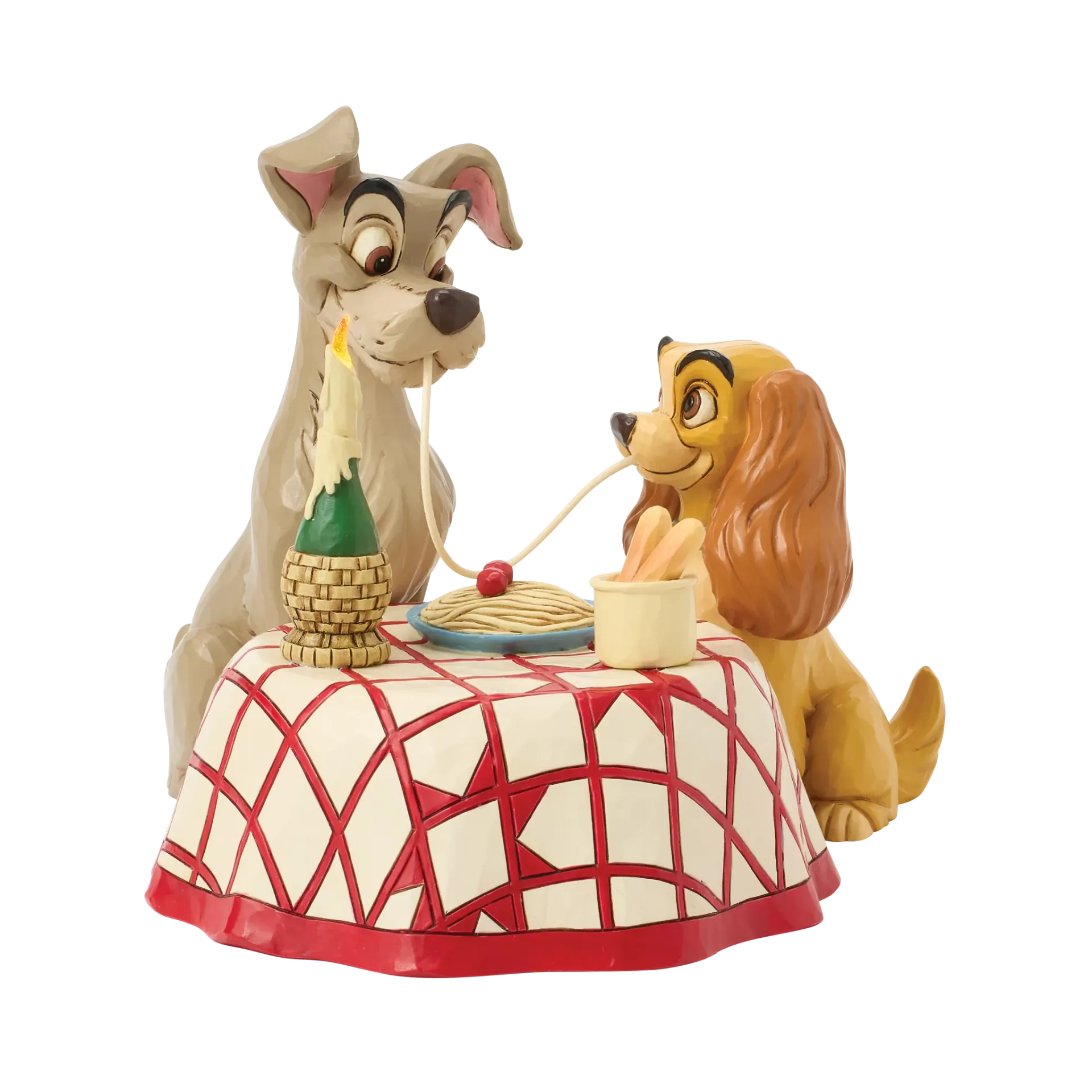 Een Disney-figuurtje van Lady en Tramp, die spaghetti eten aan een tafel met kaarslicht en een rood-wit geblokt tafelkleed.