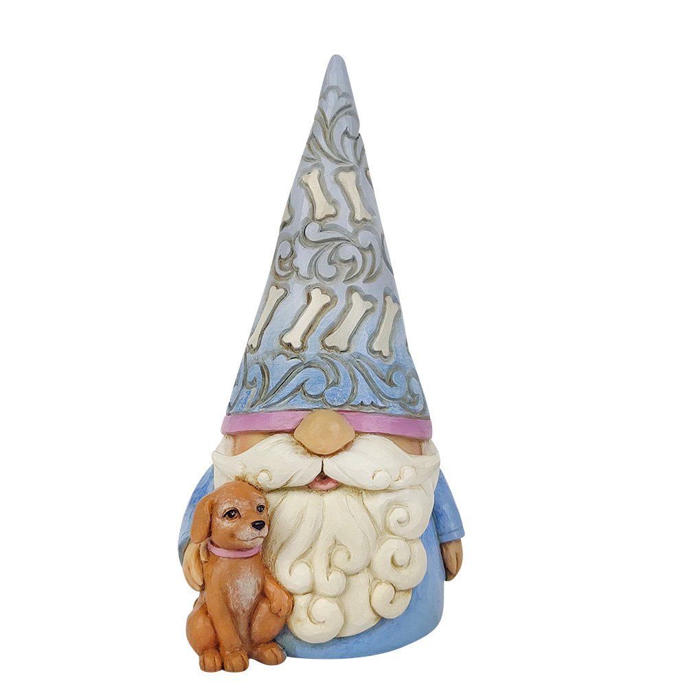 Een kabouterbeeldje met een lichtblauwe mantel en hoed, een witte baard en een klein gouden hondje met een roze halsband.