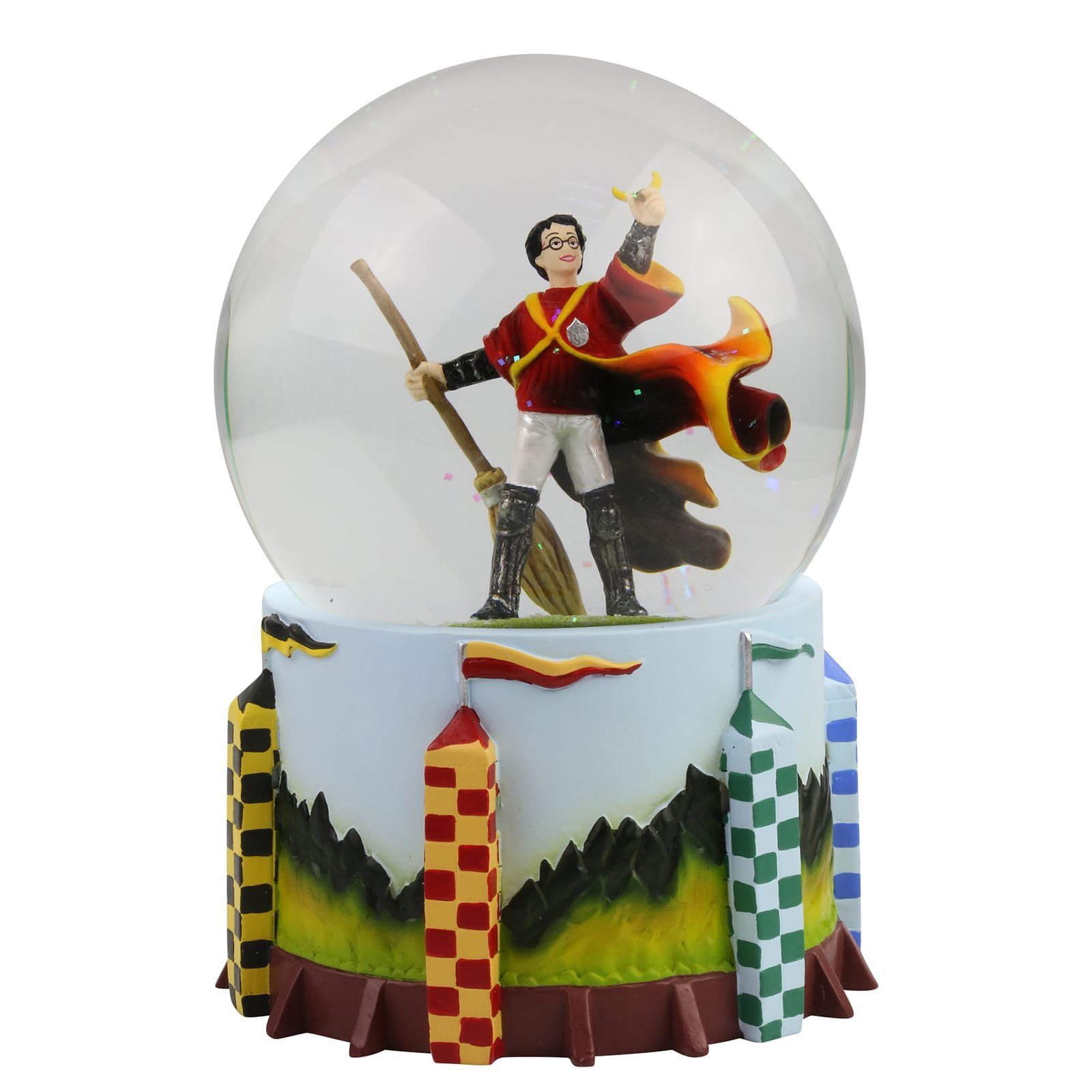 Harry Potter sneeuwbol: Harry op een bezem, in een rood-geel Zwerkbaluniform, met een groene veldbasis.