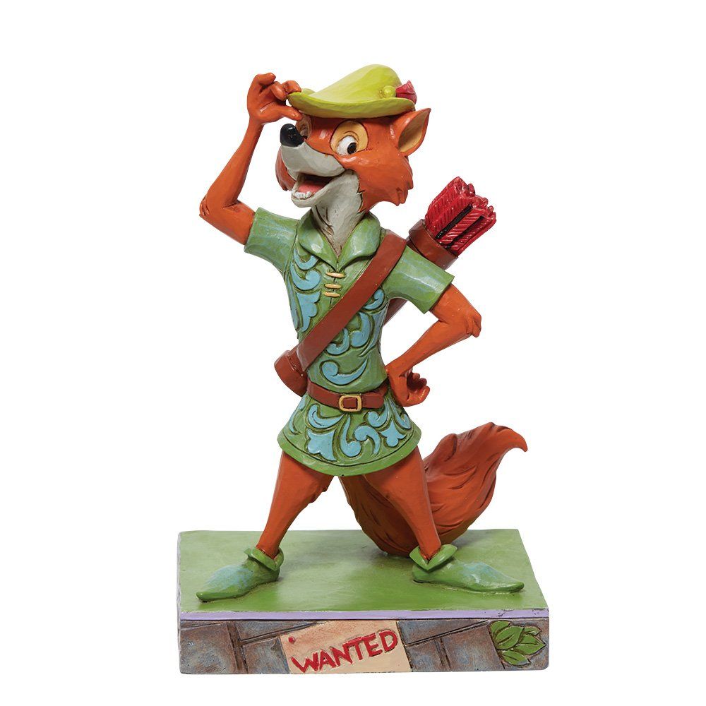 Robin Hood-beeldje, een oranje vos met groene tuniek en hoed, die een boog vasthoudt en naar boven kijkt.