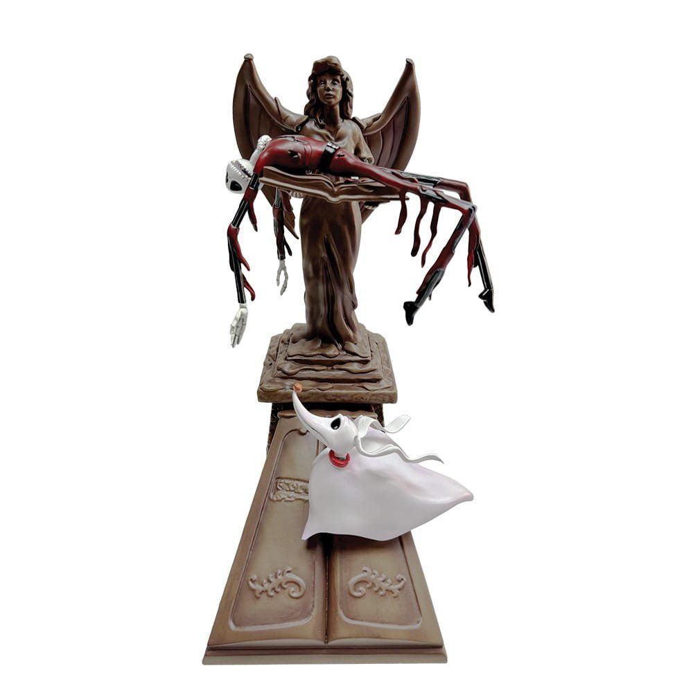 Standbeeld met een engelfiguur die een rood skelet vasthoudt. Daaronder staat een spookachtige figuur met een hondenkop.