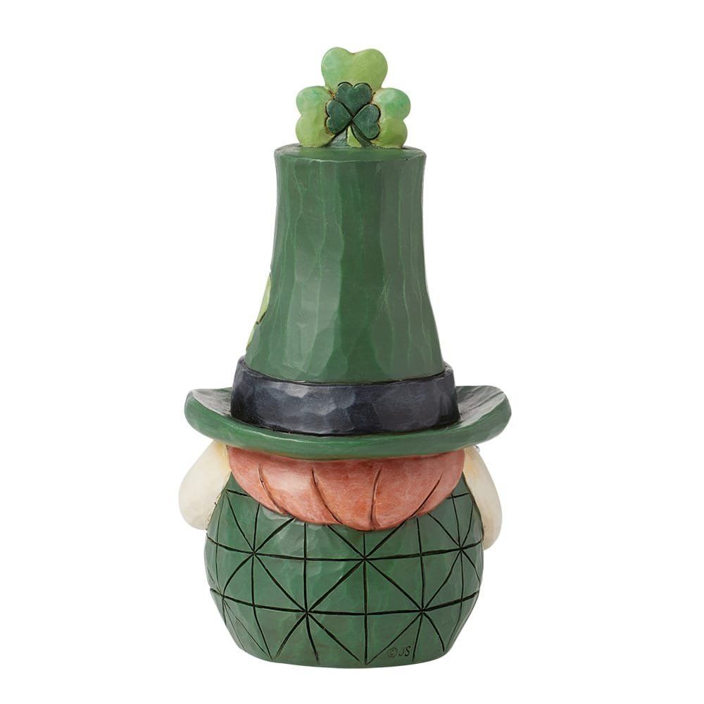 Kabouterfiguurtje met groene hoed, klavertje vier en een lichaam met patroon.