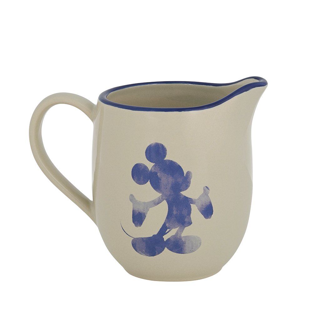 Crèmekleurige keramische kan met blauw Mickey Mouse-silhouet, blauwe rand en witte achtergrond.