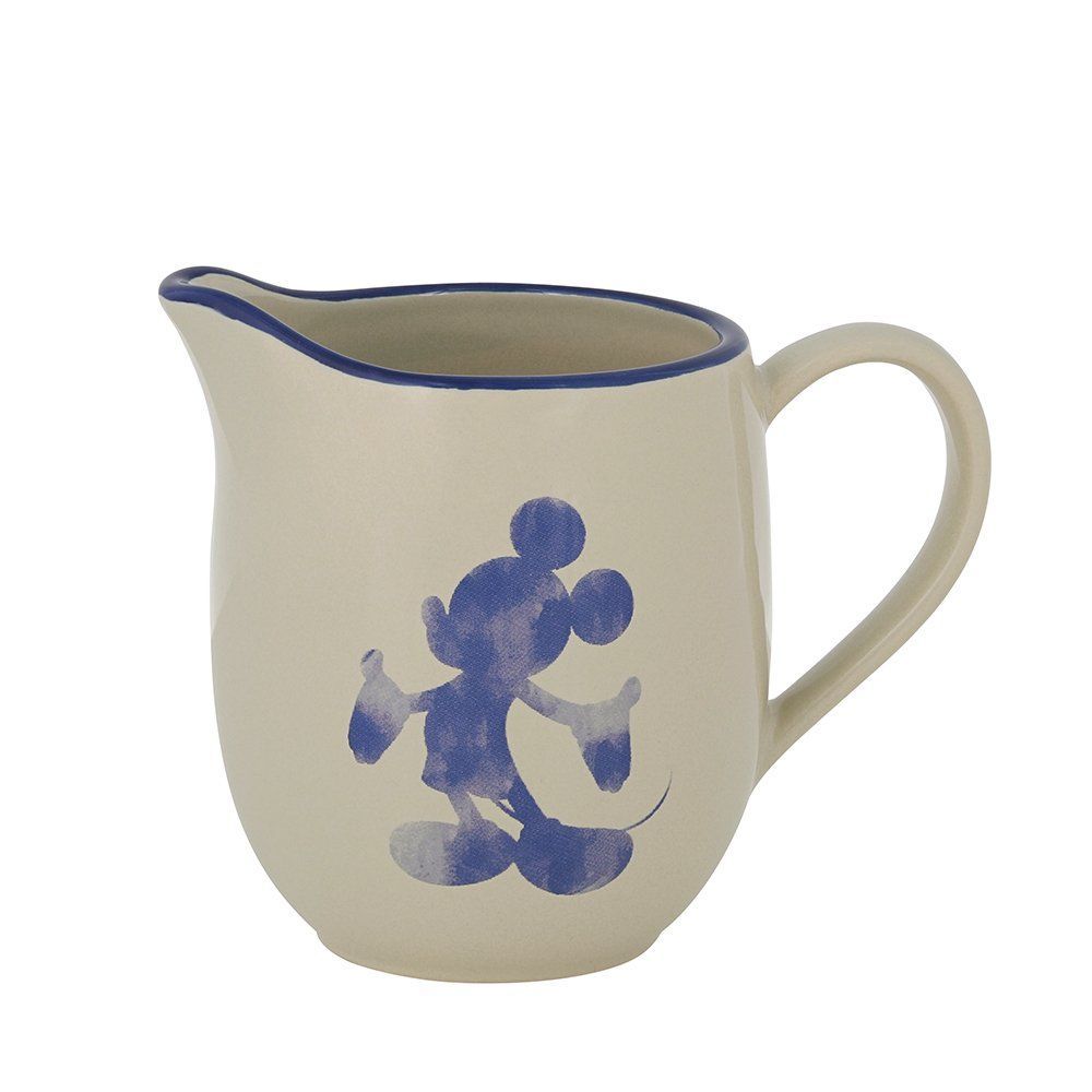 Crèmekleurige keramische kan met blauw Mickey Mouse-silhouet, blauwe rand en witte achtergrond.