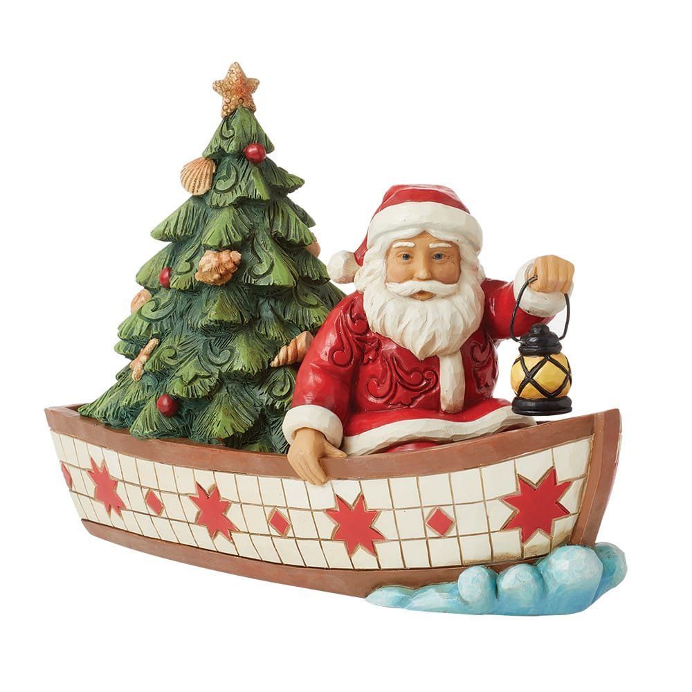 De kerstman in een boot met kerstboom en lantaarn, rood, wit en groen versierd met kerstdecoratie.