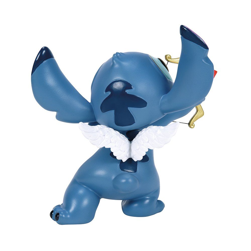Een Stitch-figuurtje in blauwe en turquoise kleuren, met een gouden boog en een pijl met een hartvormig uiteinde.