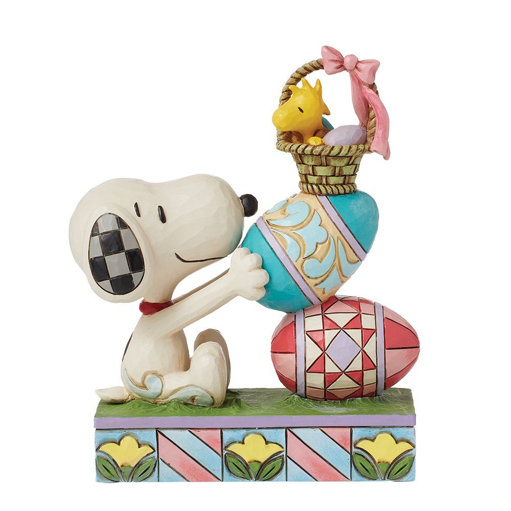 Snoopy-figuurtje met paaseieren, Woodstock en een mandje. In de kleuren blauw, roze en groen.
