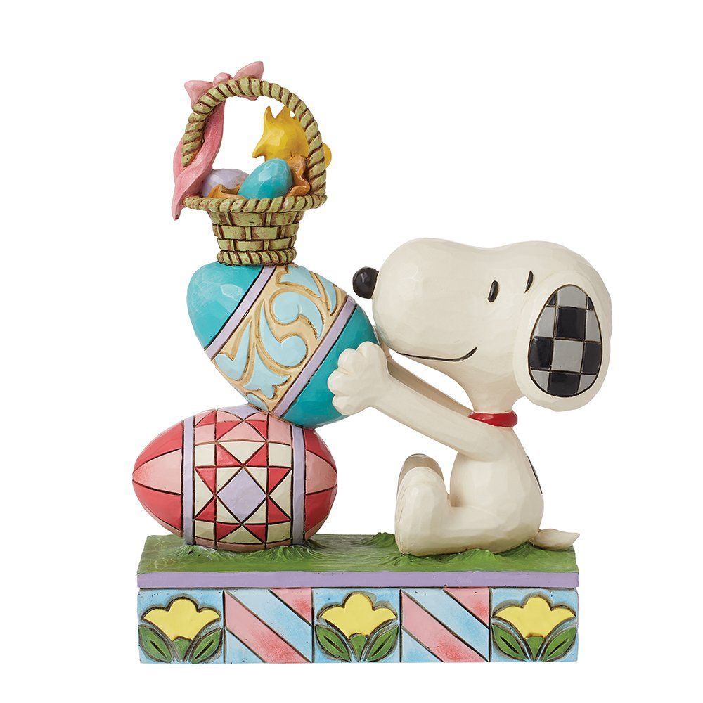 Snoopy-figuurtje met paaseieren, Woodstock en een mandje. In de kleuren blauw, roze en groen.