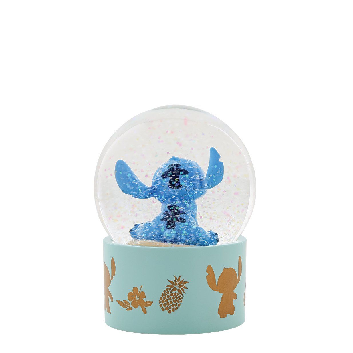 Een sneeuwbol met Stitch. Binnenin een blauwe Stitch-figuur, een lichtblauwe voet met een gouden silhouet en bloemaccenten.