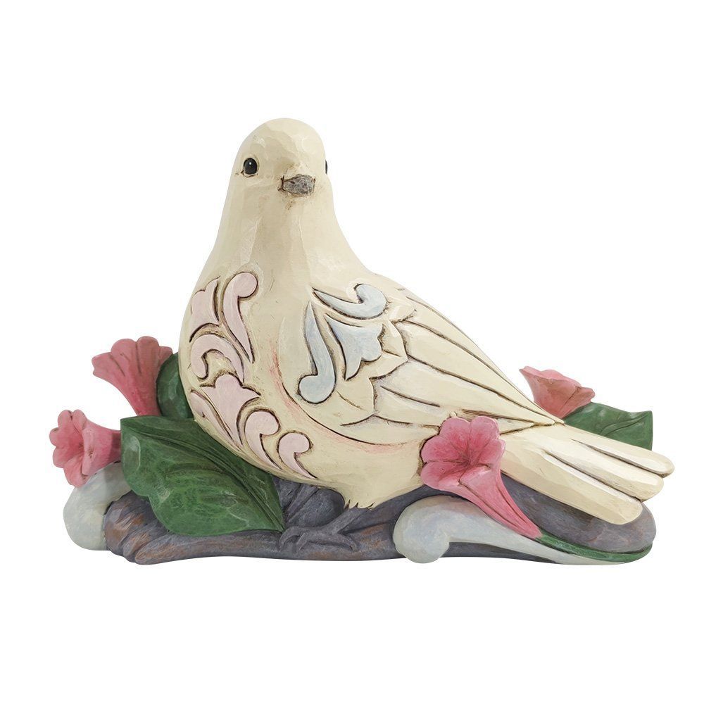 Crèmekleurig duifje, zittend op een tak met roze bloemen en groene bladeren.
