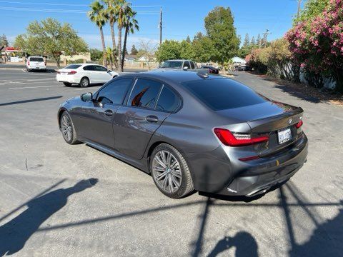 Client Black Car — Sacramento, CA — Low Cost Auto Glass & Window Tinting